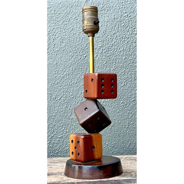 Handcrafted in the mid-20th century, this vintage accent lamp features a whimsical body sculpted from three stacked...