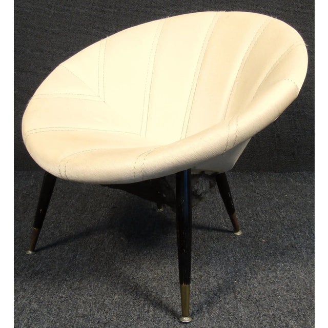 Mid-Century Modern "saucer" chair with tapered legs and brass feet. Unusual design with comfortable cushioning.