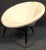 Mid-Century Modern "saucer" chair with tapered legs and brass feet. Unusual design with comfortable cushioning.