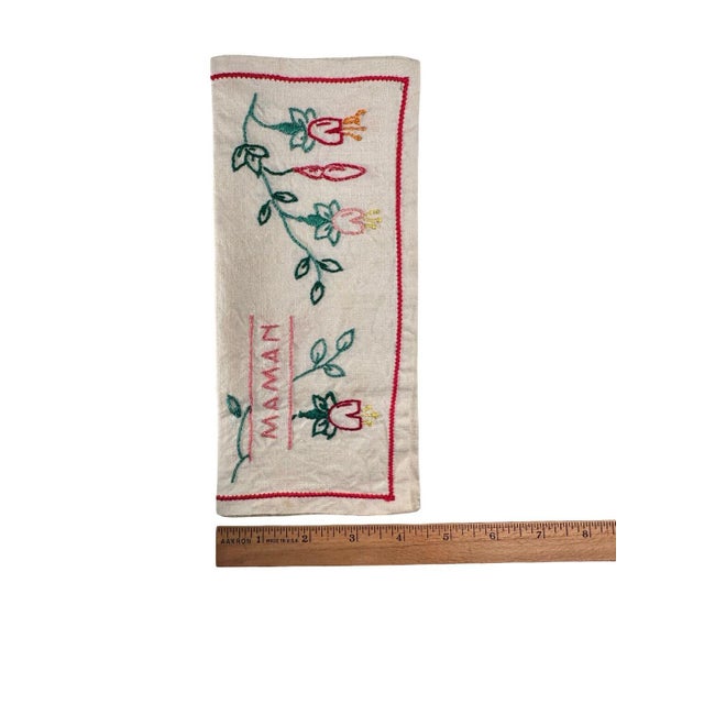 "A charming and deeply personal little handmade linen bag found in France, embroidered by hand with floral motifs and the...