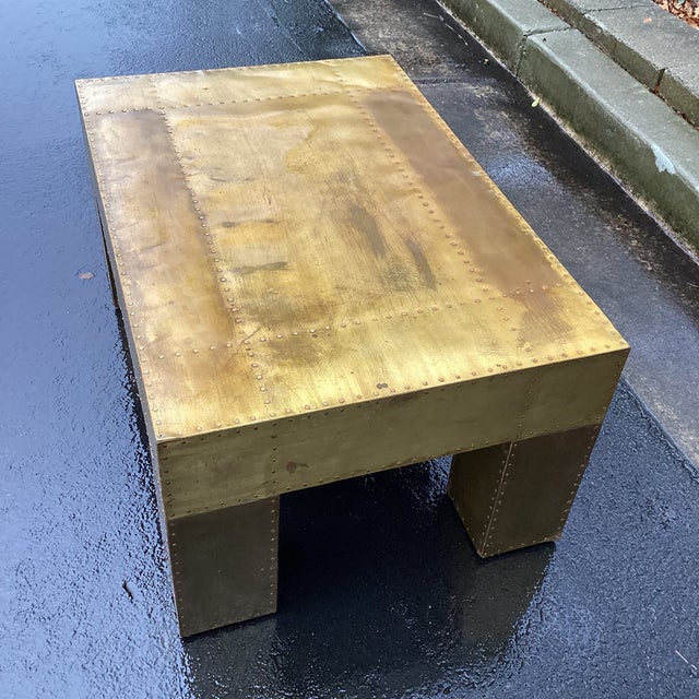 Great scale on this rectangular cocktail table by Sarried Ltd featuring a brass-clad surface with hand-applied nailhead...