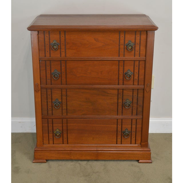 This substantial piece rests on four metal casters. antique victorian walnut eastlake 4 drawer lock side high chest