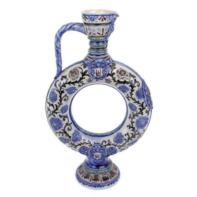 Pair of blue and white salt glazed ewers in the style of Westwald. Uniquely shaped with delicate features.