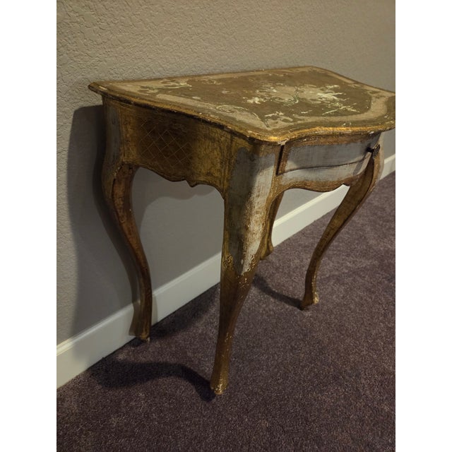 Italian Giltwood Rococo Console Table with Hand-Painted Details, Mid-20th Century Description Elegant Italian giltwood...