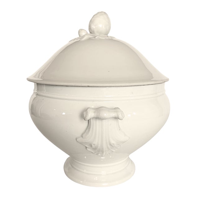 An elegant antique french white porcelain soup tureen by c.p. & cie, mehun-sur-yèvre, featuring a graceful silhouette...