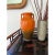 A striking Roseville Rosecraft matte finish vase from the 1920s in burnt orange with an ombre transition to burnt umber...