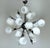 Italian modern sputnik chandelier with cream colored Murano glass shades mounted on metal frame in satin black nickel...