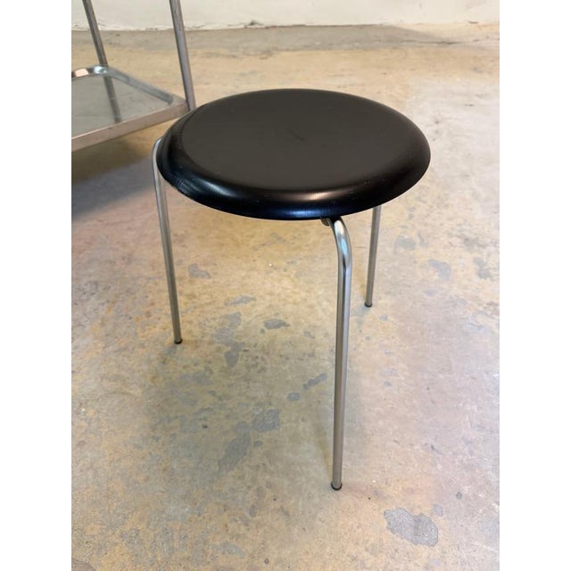 Danish furniture history: The famous Dot stool, with its three-legged tripod design by Arne Jacobsen for Fritz Hansen,...