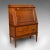This is an antique metamorphic drinks cabinet. An English, oak bureau form cocktail cabinet, dating to the late Victorian...