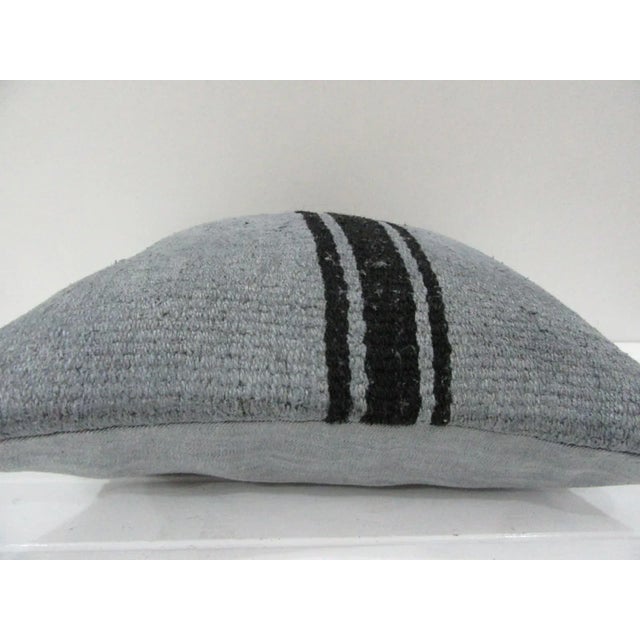 This is a pillow cover made from a vintage kilim rug. The piece was properly washed and ready to use. Pillow inserts not...