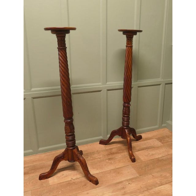This is a fine quality pair of torchere they have a 10” circular flat top with a raised moulded rim. They each stand on a...