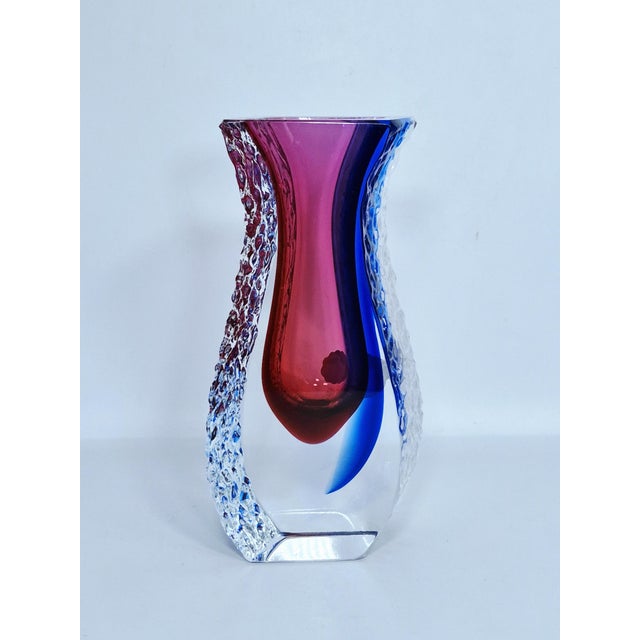 Elevate your space with this exceptional piece of mid-century Italian craftsmanship. This authentic Murano art glass vase...