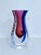 Elevate your space with this exceptional piece of mid-century Italian craftsmanship. This authentic Murano art glass vase...