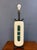 A sculptural mid-century table lamp in a tall, capsule-form ceramic body finished in a warm, pebbly cream glaze. Down the...