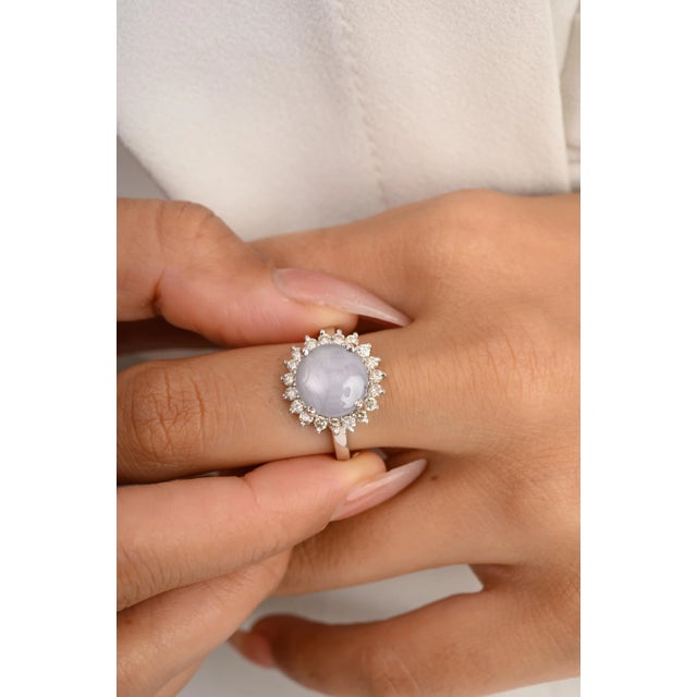 This is part of Chairish’s Fine Jewelry assortment. 4.63 Carat Star Sapphire Cabochon Halo Diamond Ring in 14K Gold...