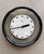 Postmodern, Memphis Design era Howard Miller clock with floating check face and black thick outer rim. Black hands and...