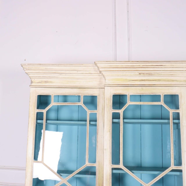 Very small 18th century English painted pine breakfront bookcase. 1790. This piece is designed in the style of the...