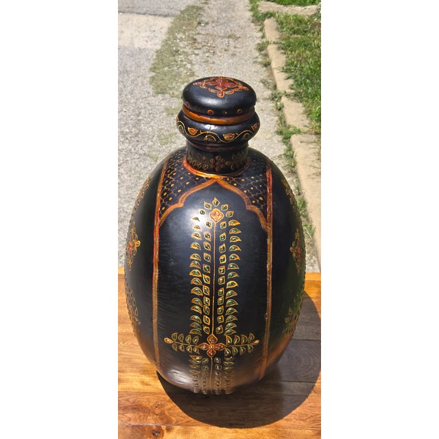 Bring warmth and artisan craftsmanship to your home with this striking vintage hand-painted pottery bottle vase. Featuring...