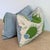 Christopher Farr Cloth Carnival Print linen lumbars in blue and green, with coordinating Schumacher blue striated cotton...