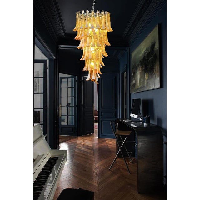 Beautiful and huge Italian Murano Chandelier composed of 83 splendid glass petals (amber with white spot) that give a very...