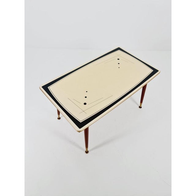 coffee table vintage table & extendable from the 50s The table is in very good condition. Made of wood, glass and brass,...