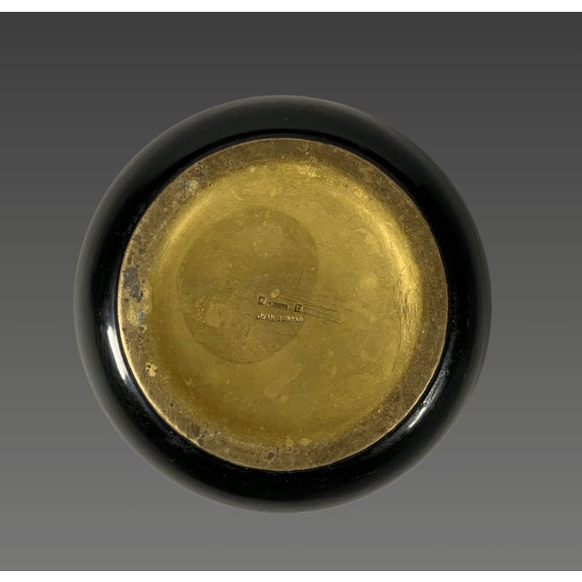 Jean DUNAND (1877-1942). Circular bowl with a slightly flared neck in gilt bronze, known as "oreum," and deep black...