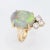 Stylish vintage opal & diamond cocktail ring crafted in 14 karat yellow gold. The natural opal measures 15mm x 11mm...