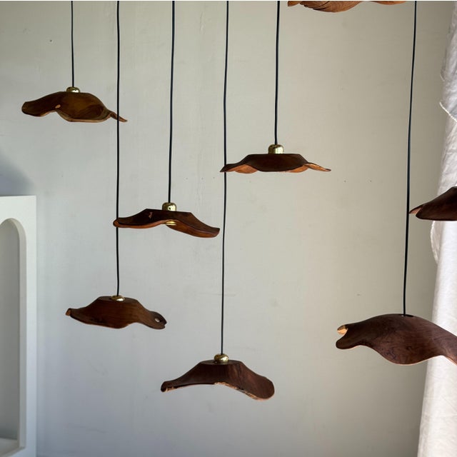 Small, flat, undulating teak leaf pendant light. Elegant and decorative design, organic, with beautiful natural wood...