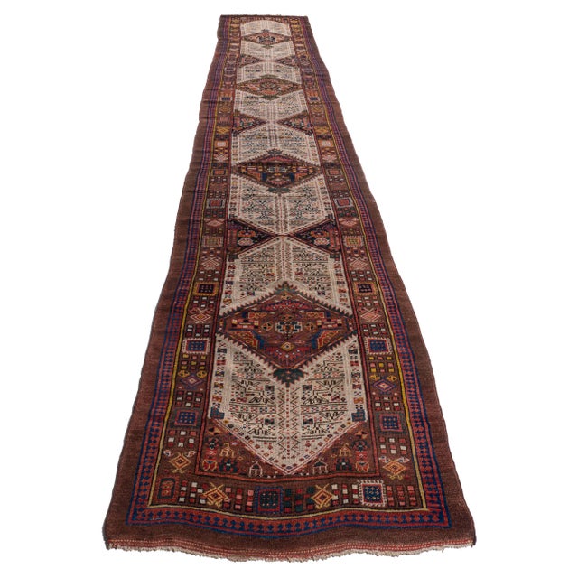 A wonderful antique Serab gallery-runner rug in a hard-to-find size. Serab is located on the edge of the Heriz weaving...