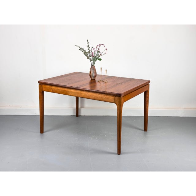 Rectangular, high-quality solid wood dining table with two central extensions that are stored under the tabletop. In...