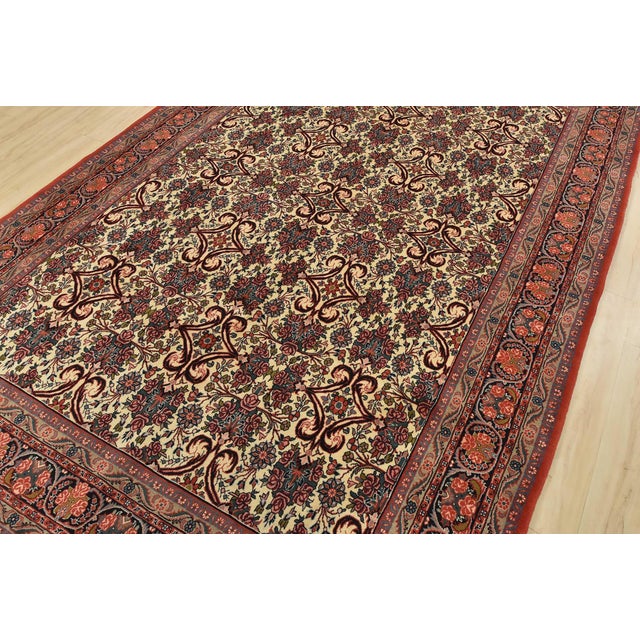 An authentic vintage traditional Bidjar rug hand-knotted with fine wool and natural dyes. This intricately woven rug...