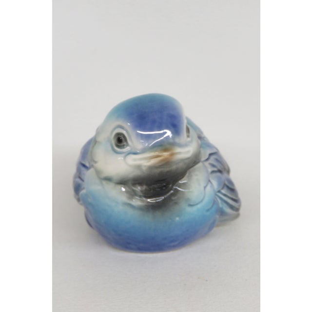 This Baby Blue Bird Figurine is made of porcelain. This Figurine was made in Germany by Goebel, it is stamped, and marked...