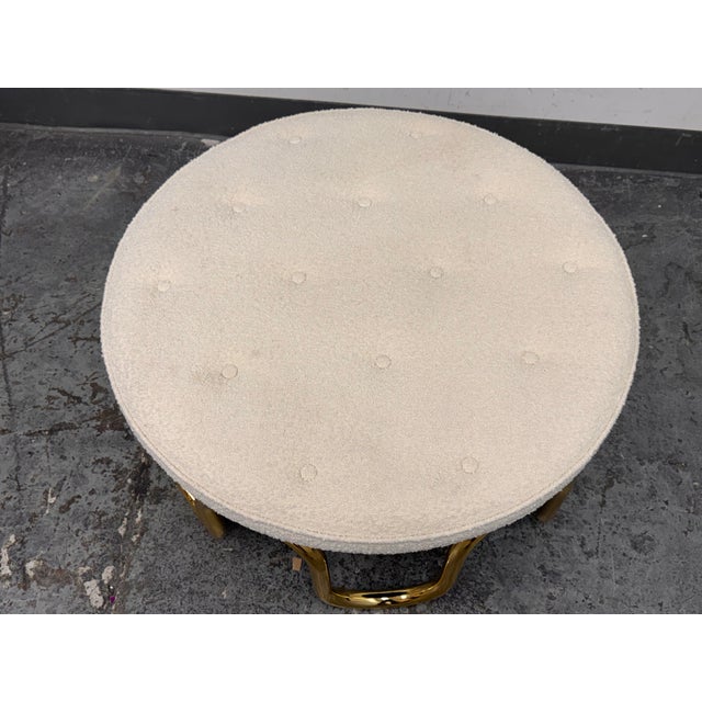 Design Plus Gallery presents the Scalinatella Ottoman by Jonathan Adler. This round ottoman is upholstered in ivory bouclé...