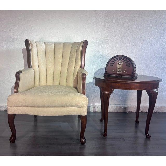 Elegant vintage wingback accent chair unknown brand, crafted in California. This classic chair features a tall channel-...