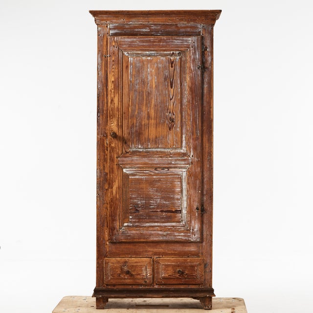 Antique Swedish solid pine cabinet with a lot of warmth, character and patina, handcrafted between 1700s and 1800s. For...