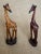 Mid 20th Century African Handcarved Hardwood Sculptures of Rhinoceros and a Pair of Giraffes These 3 lovely African Hand-...