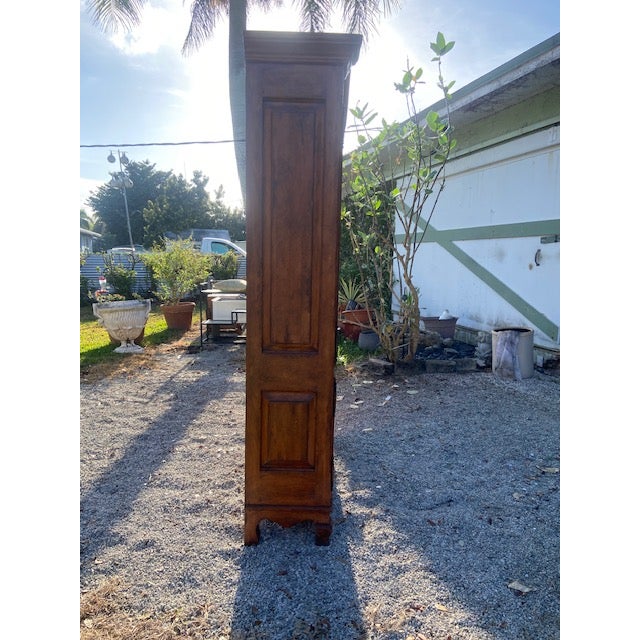 The French Provincial Cabinet from Bausman & Company, Inc. is a quintessential piece of furniture that embodies the...