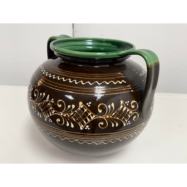 Design Plus Gallery presents a Vintage Hungarian Folk Art Double-Handled Pottery Vessel. This rounded ceramic vessel is...