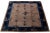 This hand-knotted wool Antique Chinese Art Deco rug features a floral design with black hues on a brown background and a...