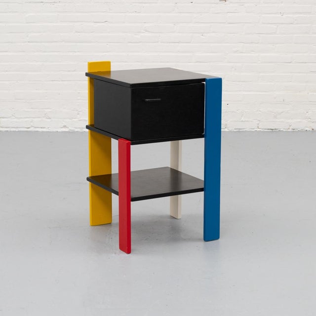 1980s postmodern side table clearly influenced by the visual language of Gerrit Rietveld and the De Stijl movement. The...