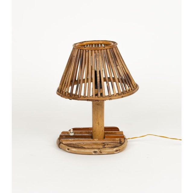 Midcentury amazing table lamp in bamboo and rattan in the style of the French designer Louis Sognot. Made in Italy in the...