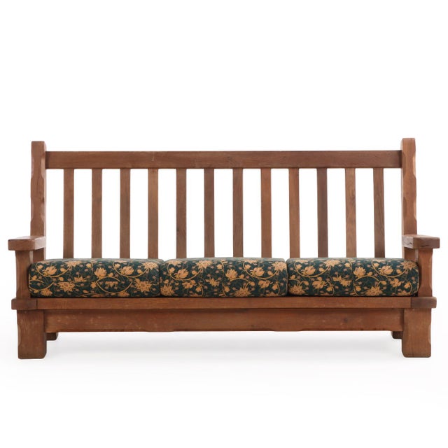 A striking example of mid-century European craftsmanship, this French heavy oak sofa frame, circa 1960, embodies the bold,...
