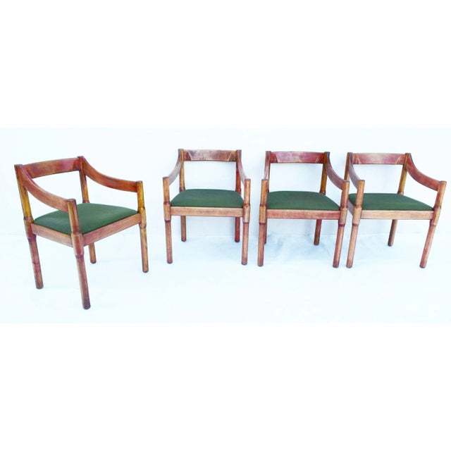 Set of 4 "Carimate" model armchairs designed by Vico Magistretti in 1961 in Italy. The armchairs are of beech wood with...