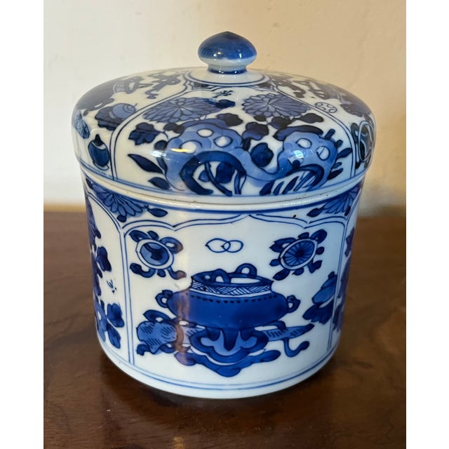 Antique Kangxi Period 1662 - 1722 blue & white porcelain covered jar decorated with panels of precious objects. Measures 4...