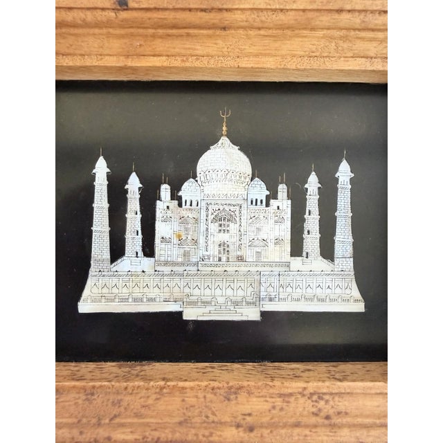 Intricately carved and painted mosaic in handmade wood frame.