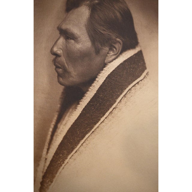 An original vintage photogravure from Edward S. Curtis's monumental The North American Indian, Portfolio IX (1913),...