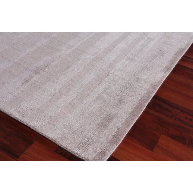 The linear tonal design of the Iscar rug is at once casual, chic and ultra sophisticated. Made of luxurious bamboo silk,...