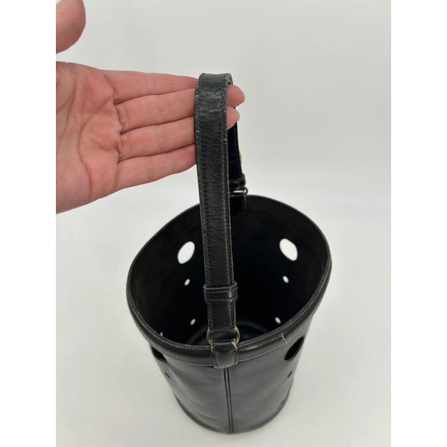 Hermes Vintage Black Box Calf Leather Mangeoire Bucket Bag in fair condition. Black box calf leather trimmed with golden...