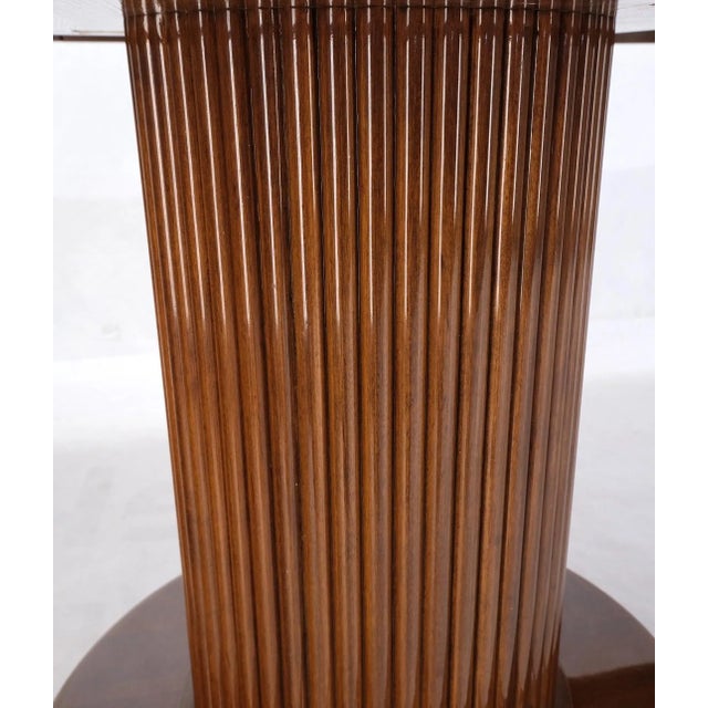 Burl Walnut three extension boards single pedestal round dining table three (3) table leaves measure 21 inches across.