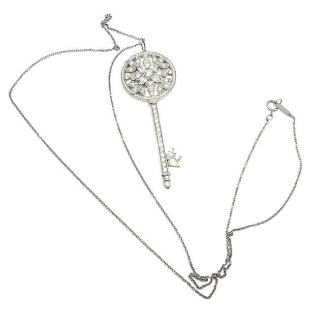 Crafted in platinum, this Tiffany & Co. Victoria Vine Key pendant necklace features a delicate circular motif adorned with...